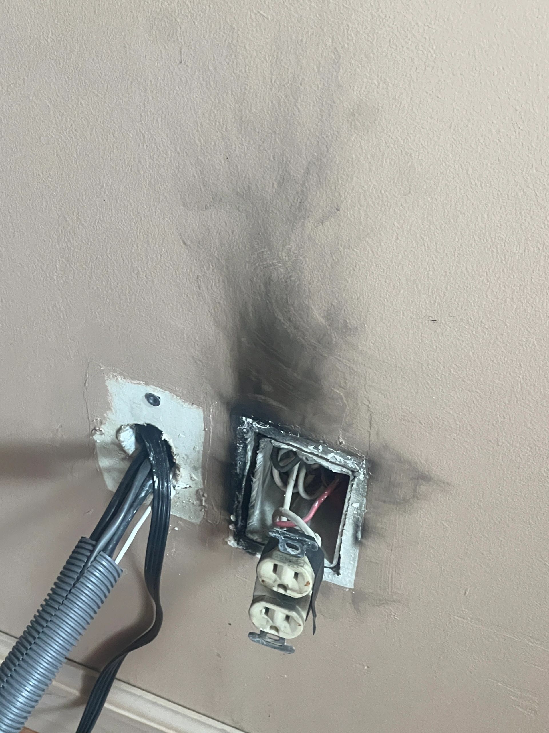 Heat damage around a garage receptacle used for vehicle charging